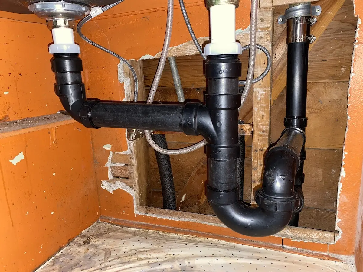 Professional Garbage Disposal Repair equipment and tools on the job in Midfield